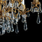 Lampadario con cristalli a goccia in ferro battuto stile classico